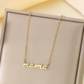 Close-up of a 18K gold-plated stainless steel necklace with a cursive mama pendant - mama Classic Script Style (KN287415-KLX)
