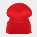 Classic red knitted beanie for men and women featuring a minimalist solid color design - Red