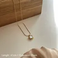 Minimalist gold titanium necklace with a square white shell pendant on fine snake chain - Square Mother of Pearl Pendant