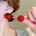Close-up of elegant red resin pearl earrings with glitter details on a model - 23# Silver Earring Post - Red - Diameter 21mm