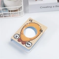 Close-up of beige 3-inch mini photo album with cartoon fried shrimp and round window - Fried Shrimp Round