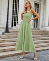 Detail of light green floral strap dress featuring tiered hem and ruched waist accents - Sage Green