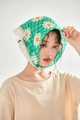 Close-up of lightweight cotton linen scarf with daisy print worn as a headwrap - Green Big Floral