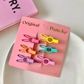 Set of 6 colorful macaron bunny-shaped metal hair clips on a pink display card - Candy Color Rabbit