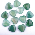 Polished green aventurine heart shaped gemstones with unique natural patterns - Green Agate