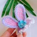 Handmade crochet bunny ear hair clip in purple yarn with small blue flower and pearl detail - Purple Pink Gauze Rabbit Ears