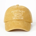 Close-up of Vintage 1973 printed text on yellow washed cotton baseball cap details - One Size / Yellow
