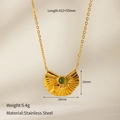 Macro shot of gold stainless steel clover pendant necklace with green stone inlay - Fan Dangle