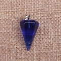 Close-up of a faceted deep blue crystal pendulum pendant on a natural jute background - Transparent Blue