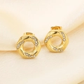 Detailed macro view of golden twisted hoop earrings with white zircon on silk - Twisted Round Ring Style (KE116536-GC)