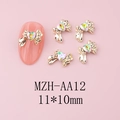 Dettaglio dei ciondoli per unghie a fiocco dorato 11x10mm con strass a cuore colorati - Base Oro Rosa Sfumato Verde (AA12)