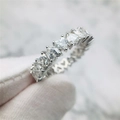 Macro detail of silver heart zircon ring featuring fine prong setting and hollowed carvings - US 6 / White Gold