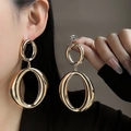 Statement gold-tone double oval hollow earrings with polished metallic finish - E854-2 Double Oval Ring