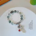 Ethnic green phantom crystal bead bracelet with vintage silver flower charms and tassel - Green Ghost: Blossoming Riches Long Tassel Bracelet