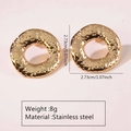 Detail view of gold stainless steel chunky hoop earrings with a textured lava finish - Stainless Steel Lava Textured Hoop Studs
