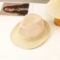 Detailed view of beige straw fedora featuring breathable mesh top on a stylish white desk - Off White