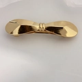Elegant gold bow-shaped metal hair clip with a smooth polished finish on white background - Gold Shiny Angular Bow Clip