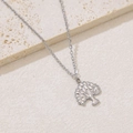 Detailed close-up of a silver-tone tree of life pendant on a delicate cross chain - Tree of Life Pendant (NKS-002_07A)