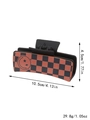 Western style black and orange checkered leather hair claw with star and smile patterns - Black Orange-Red Checker Smiley (90051)