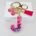 Detail of pink resin letter J keychain with gold butterfly charm and vibrant tassel - Rose Red Butterfly Tassel Clip / Letter J