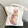 Floral canvas tote bag featuring an artistic cat silhouette filled with colorful flowers - C1 Floral Cat