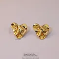 Polished golden stainless steel heart shaped wave stud earrings in 2.45cm size - Wave Heart Petals (FYD6160)