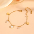 Detailed view of a gold clover bracelet with white shell inlays and zircon charms - Gold White Shell Bracelet (C519)