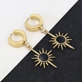Detail of gold huggie earrings with sunburst charms and black enamel inlay for modern look - Sun Flower - Gold