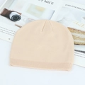 Winter knitted beanie in light beige, featuring a ribbed cuff and soft texture for warmth - Off White
