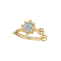 Detailed macro view of gold ear cuff with blue opal stone and small round zircon accent - Round / Gold-Multicolor Round Stone