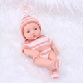 Realistic 20cm reborn baby doll wearing pink striped knit outfit on white fur blanket - Orange Pink Striped Sweater