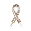 Macro shot of ethnic woven bag strap featuring geometric patterns and golden metal clasps - Gold Hardware / Camel