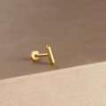 Macro detail of a minimalist gold-plated stainless steel bar labret stud with flat back - Gold Minimalist Straight Bar