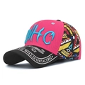Pink baseball cap with blue NHC embroidery and printed visor in a stylish patchwork design - Adjustable / HC Rose Red Front