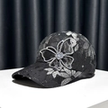 Women's black lace baseball cap featuring a large rhinestone butterfly decoration - Adjustable / Black