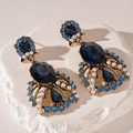 Detail of vintage blue crystal teardrop earrings with pearls on textured stone - Blue Rhinestone Water Drop Style