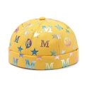 Bright yellow docker brimless cap featuring metallic star and letter M prints - Adjustable / Yellow