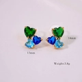 Macro shot showing green and blue heart-shaped zirconia studs with dimension and weight marks - Earrings-Blue Series