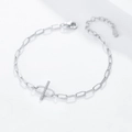 Macro shot of S925 sterling silver chain bracelet with zircon cross bar and hallmark - 925 Silver / Silver