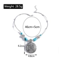 Dettaglio della collana mandala bohémien con perline di turchese e ciondoli a rosa - YN708/Ciondolo Disco Mandala