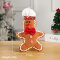 Plush gingerbread man Christmas ornament with red bow and peppermint buttons, 17cm height - 17cm x 11cm