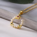 Macro view of gold-plated necklace featuring a pearl-studded C-pendant with colorful stars - C-Shape Star Pearl Style (23388)
