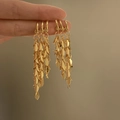 Elegant gold metal wheat leaf tassel earrings with a stylish minimalist dangle design - Gold