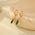 Detailed close-up of gold leaf earrings with green malachite stone on soft background - Green Cylinder