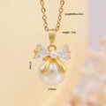 Elegant gold bow necklace with white crystals and large round pearl pendant - Gold