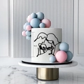 Close-up of a 9cm black acrylic baby shower cake topper with a family line art design - Parents Style 1 / Black