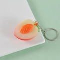 Miniatur-PVC-Pfirsich-Anhänger Schlüsselanhänger mit realistischer Textur und Metallring - Pfirsich - Schlüsselanhänger