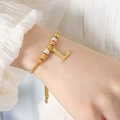 Elegante 18K vergulde titanium stalen armband met letter L hanger en zirkonen - Gouden Armband - Letter L
