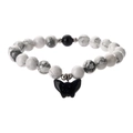 White marble bead bracelet with dark blue goldstone and butterfly charm on white background - White Turquoise + Blue Sand Stone