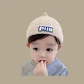 Beige baby knit winter hat with PUG patch and ear flaps for warmth and wind protection - Leather-labeled Nipple Beige (2 Months - 2 Years)